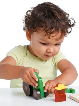 Child assembling the tractor