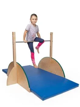 Child doing gymnastics on the indoor children's horizontal bar Child doing gymnastics on the indoor children's horizontal bar