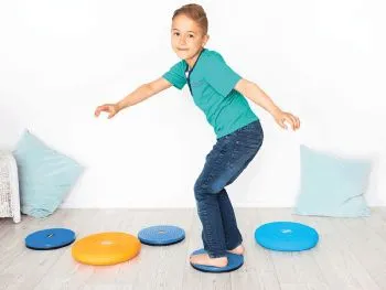 Child balancing on the spin board Child balancing on the spin board