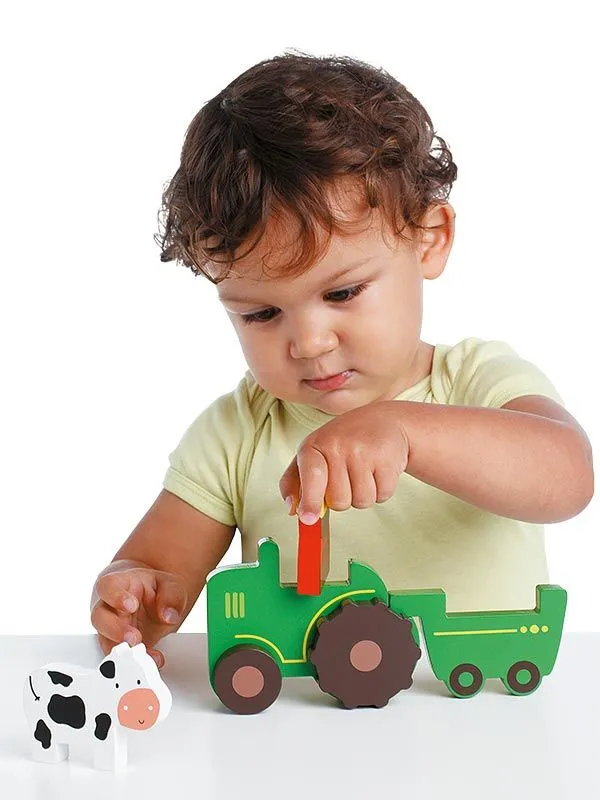 Magnetic game tractor with child trying it out