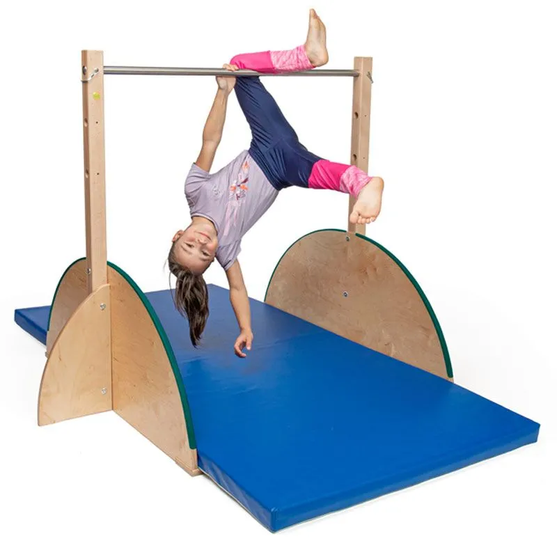happy child doing gymnastics on the indoor children's horizontal bar happy child doing gymnastics on the indoor children's horizontal bar
