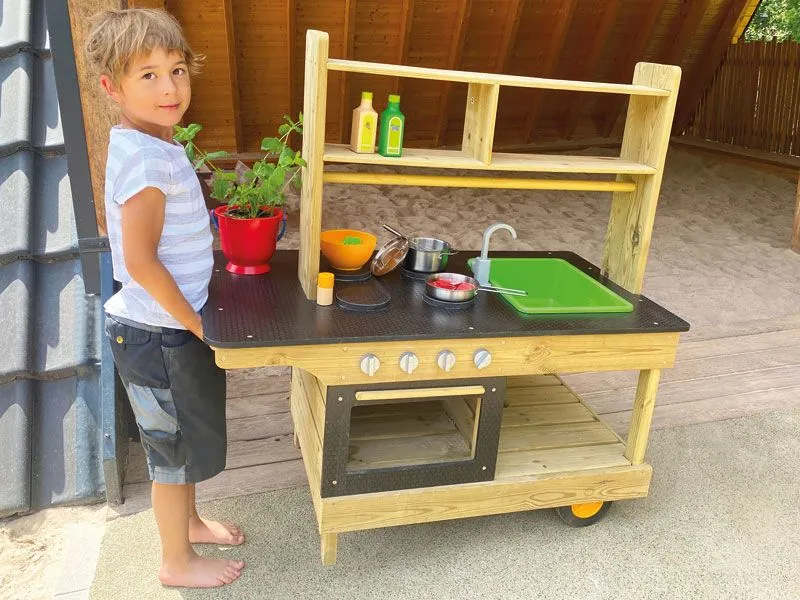 Mobile play kitchen with child for easy transport Mobile play kitchen with child for easy transport
