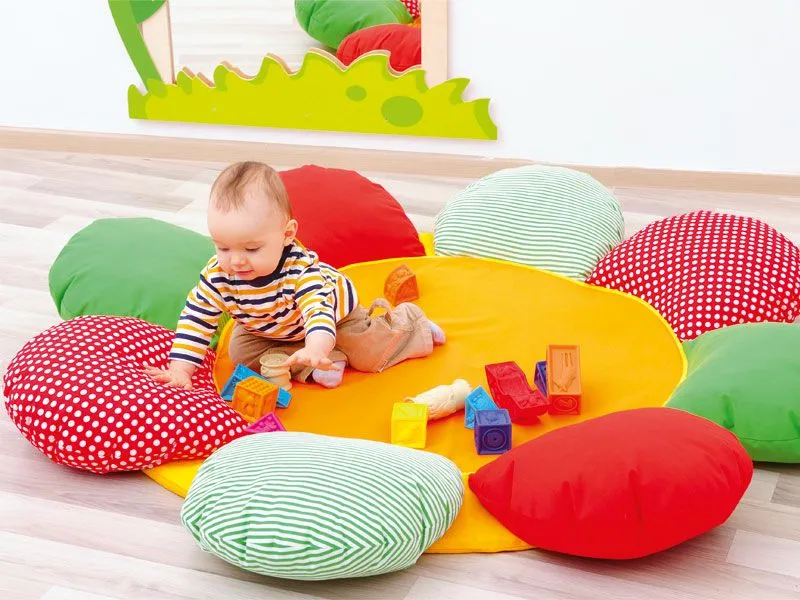 Cuddly pillow flower with playing toddler Cuddly pillow flower with playing toddler