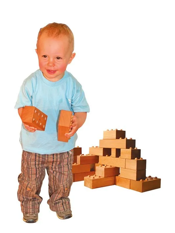 timber-frame construction stones with noppen with happy playing boy