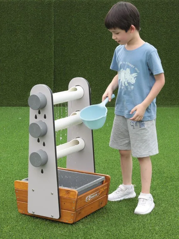 Water game raindrops with child observing the different outflow Water game raindrops with child observing the different outflow