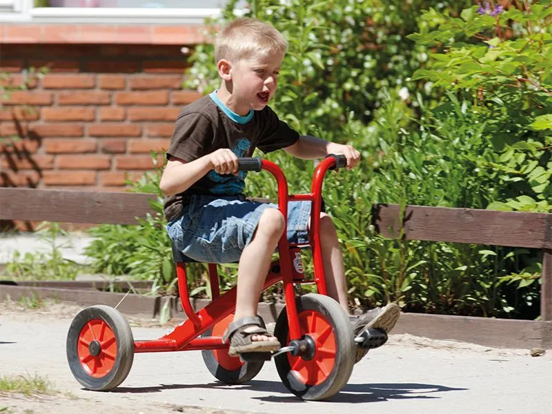 Tricycle medium by winther with happy driving boy Tricycle medium by winther with happy driving boy